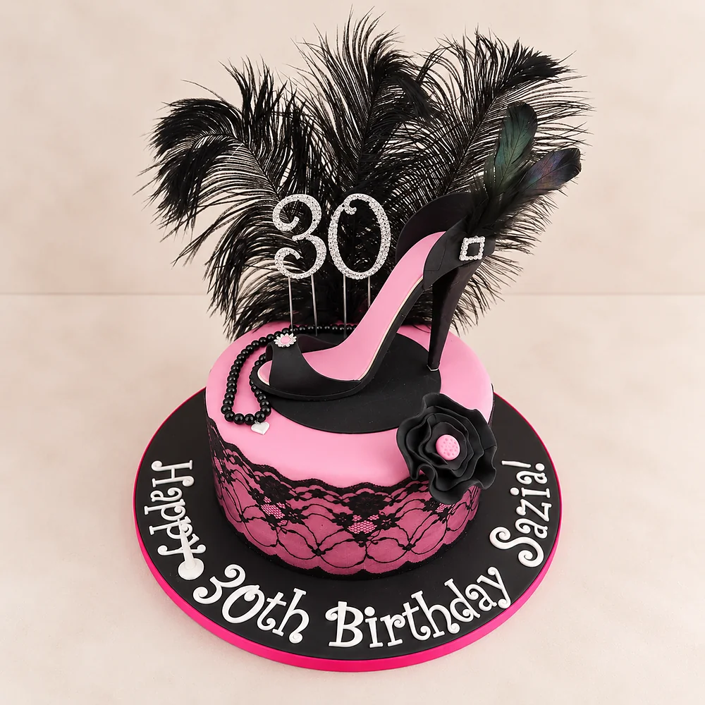 Pink and black high heel cake with a feather topper
